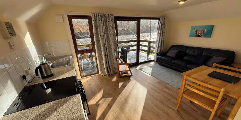 Burnbank lodges offer privacy among tall trees.