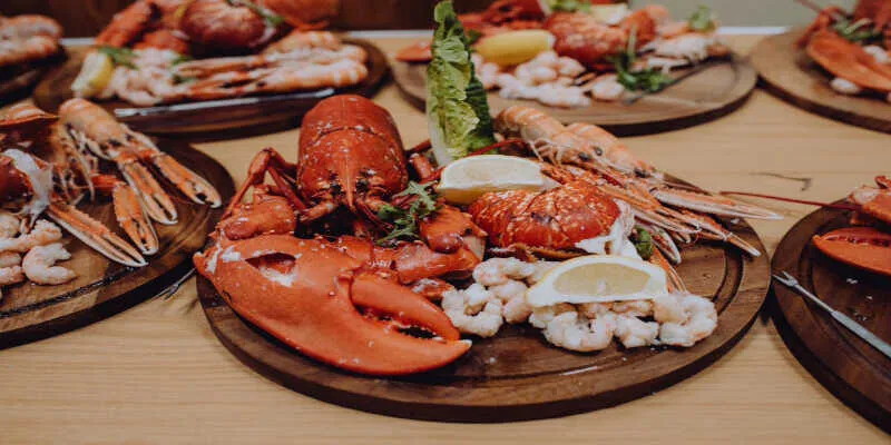 Fresh large crabs served on rustic wooden tables