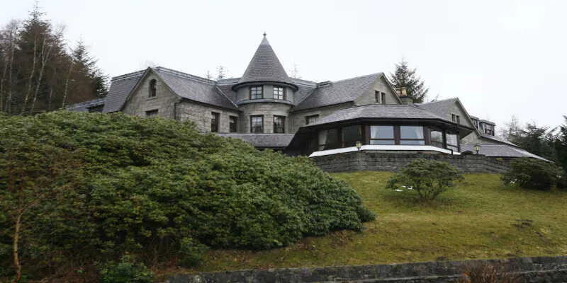 The elegant dining room overlooks the misty peaks.